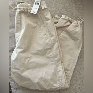 Cream colored parachute pants